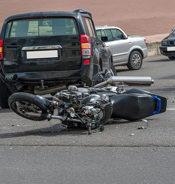 Black car rear end collision motorcycle