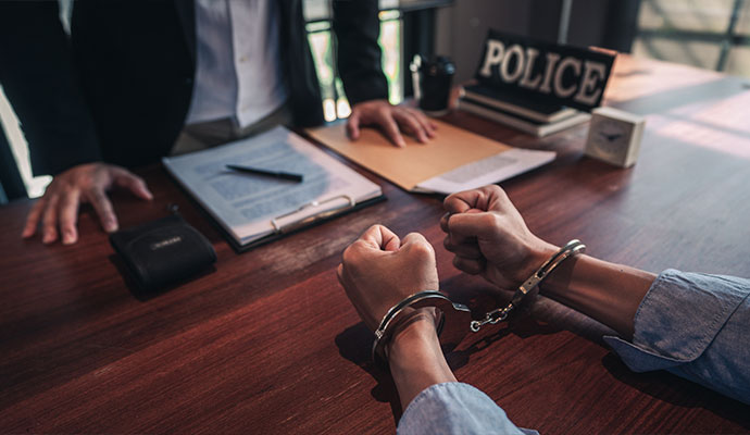 Handcuffed suspect police interrogation