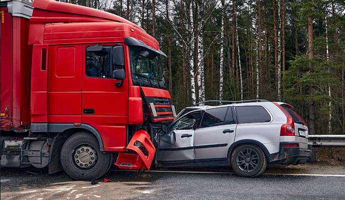Red semi truck accidents silver car