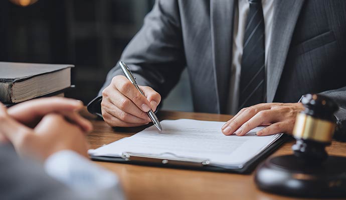 A legal professional signing a document