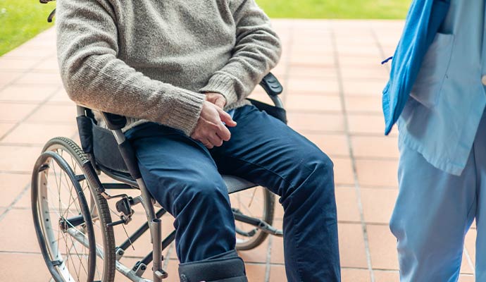 An injured person sitting on a wheelchair